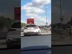 Moment car rams moped rider off busy A-road as helpless drivers watch in horror