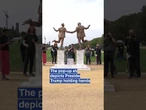 Pop-up statue of Trump and Epstein draws crowd near US Capitol