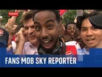 Arsenal fans gatecrash Sky News reporter's live broadcast