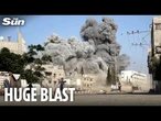 Moment huge explosion hits school in Gaza sending people running for cover