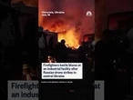 Firefighters battle blazes at an industrial facility after Russian drone strikes in central Ukraine