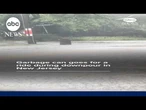 Garbage can goes for a ride during downpour in New Jersey