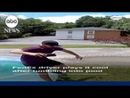 FedEx driver plays it cool after tumbling into pool