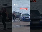 Moment £120k Range Rover is submerged by rising tide after owner gets luxury SUV stuck in sand