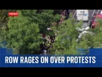 Row rages on over migrant protests
