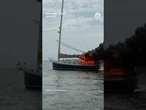 Police bodycam video captures a rescue from a burning sailboat