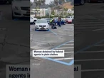 Woman detained by federal agents in plain clothes