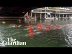 Moment hundreds of people plunge in Chicago River for first official swim in 100 years