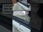A driver is rescued after their vehicle gets submerged in a sinkhole