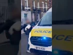 Moment man punches police wing mirror before being Tasered to the ground in London