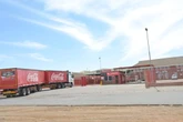 Kommer oor Coca-Cola oorweeg om Bloem-aanleg te sluit