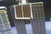 Spacewalking astronauts finish installing new solar panel after delay