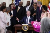 Black Americans laud Juneteenth holiday, say more work ahead