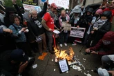 Pro-Palestine protesters burn diplomas at Columbia graduation