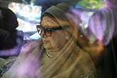 Bangladesh under pressure to hold elections as former premier returns