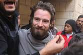 US man freed from Syria jail on way to Jordan – but wants to return