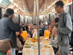 New Yorkers host lavish Thanksgiving dinner in subway car