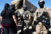 College professor accused of assault during ICE cannabis farm raid