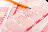 Woman won $100,000 in lottery after buying ticket on her way to work