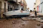 What caused the devastating flash flooding in Spain?