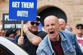 Protesters clash outside hotels amid rising tensions over asylum