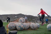 Greenland plays football all day and night. They need someone to face