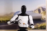 Tesla shows off new Optimus robot poaching an egg