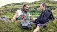 Russell Brand embraces Bear Grylls in photo from River Thames baptism