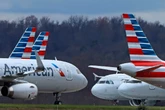 American Airlines makes emergency landing after device catches fire