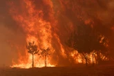 Spain battles record wildfires even as temperatures begin to fall