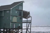 Dozens rescued as remnants of typhoon hits Alaska while nor'easter brings flooding to East Coast