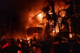 Three dead after protestors torch regional parliament in Indonesia