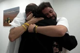 ‘How long we dreamed of this day’: hugs and tears as loved ones freed