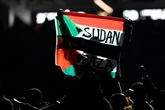 Super Bowl halftime performer arrested after police say he held flag stating 'Sudan and Free Gaza.'
