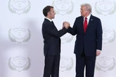 Trump’s aggressive embrace returns with Macron and UAE leader
