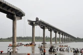 Cars plunge into river killing 9 people as bridge collapses in India