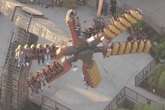 Nearly two dozen people stuck midair for hours on amusement park ride