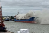 Fire rages on cargo ship with smoke and ‘burning plastic’ smell