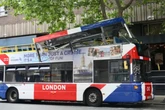 Open-top London tourist bus crashes into tree