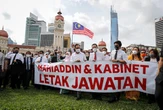 Malaysia PM defies calls to quit, wants confidence vote next month