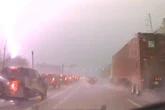 Bolt of lighting hits transformer by highway causing huge fireball