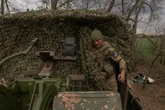 Ukraine enlists prisoners to shore up army as Russians push forward
