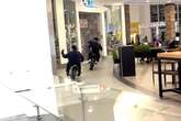 Chaos as dirt bike riders race through busy California shopping mall