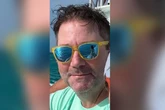 Body found amid search for American tourist who vanished on island