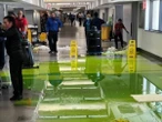Bright green liquid gushes from ceiling at Miami International Airport