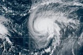 Two tropical storm systems near each other could wind up shielding the Carolinas from damage