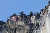 Protestors hang upside-down US flag off of El Capitan in Yosemite