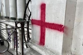 Vandals graffiti St George’s Cross on historic building