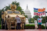 Trump sees public image drop as National Guard pose with DC tourists
