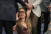 Woman dragged out of meeting after speaking during ICE rules hearing